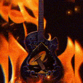 a guitar with the letter r on it in front of flames