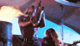 a man is playing a saxophone with flames coming out of it