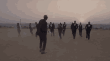 Dancing In Suits In The Dust GIF - Sons Of Kemet Dust Kick GIFs