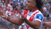 a man in a red and white jersey that says deicorp on the sleeve