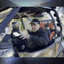 a man in a black hat is driving a vehicle that says highlights