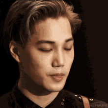 a close up of a man 's face with illegalkai written on the bottom right corner