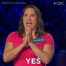 a woman in a pink shirt with the name shannon on it says yes