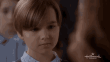 a young boy in a hallmark channel advertisement