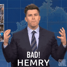 a man in a suit and tie says bad henry