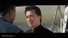 a movie clip from movieclips.com shows a man in a suit and tie