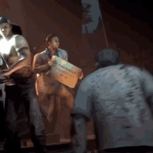 a man holding a sign that says fireworks showtime