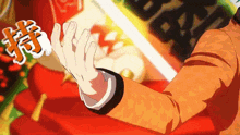 a man in an orange suit is clapping his hands