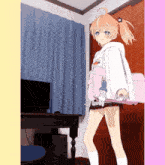 a girl is holding a pink bag in her hand