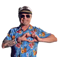 a man wearing a captain 's hat and sunglasses making a heart shape with his hands