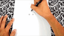 a person drawing with a stabilo marker
