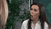 a woman with a surprised look on her face