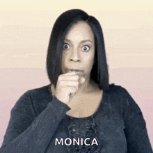 a woman is making a funny face and the name monica is on the bottom right
