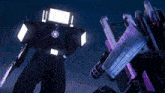 a robot with a gun and a rubik 's cube on it