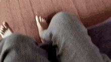 a close up of a person 's feet on a carpet