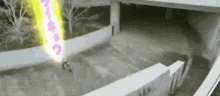 a person is riding a skateboard down a set of stairs with a light coming out of their hand .