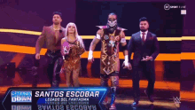 a group of people are walking on a stage with a sign that says smack down .