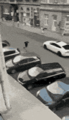 a row of cars parked on the side of a street