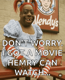 a wendy 's sign is behind a woman in a costume