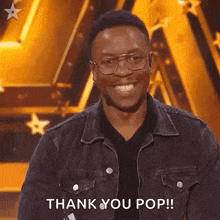 a man wearing glasses is smiling and saying thank you pop .