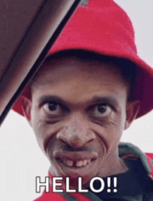 a man wearing a red hat and a red shirt says hello