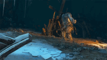 a video game character is chained to a tree stump in a cave