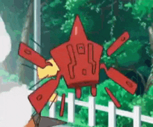 a red cartoon character is flying over a white fence in a forest .