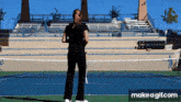 a woman is standing on a tennis court with a make a gif.com watermark