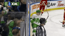 a hockey player wearing a green jersey that says st. patty on it