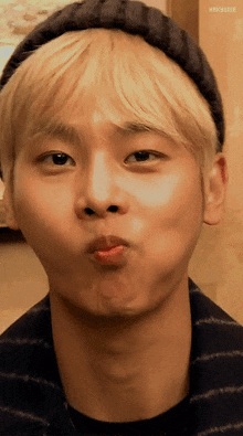 a close up of a man making a funny face with his mouth open