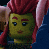 a close up of a lego character with red hair and a tattoo on her face