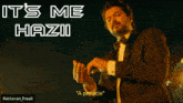 a man in a suit is standing in front of an airplane with the words " it 's me haziii " written on the bottom