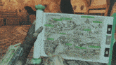 a person is holding a map that says the forsaken lands on it
