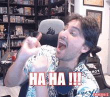 a man giving a thumbs up with the words ha ha written on his face