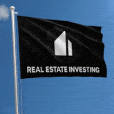 a black flag with real estate investing on it