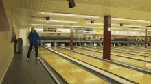 a bowling alley has a sign on the wall that says ' stefanela '