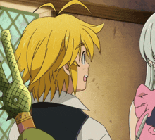 a man with yellow hair is holding a sword