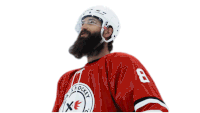 a hockey player with a beard wearing a red jersey with the number 8 on it