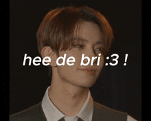 a man in a suit and tie with the words hee de bri : 3 written above him