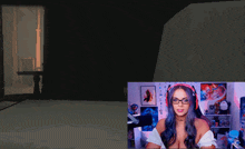 a woman wearing glasses and headphones is sitting in front of a computer screen