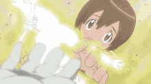 a cartoon girl is being held by a person 's hand .
