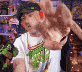 a man wearing a teenage mutant ninja turtle t-shirt