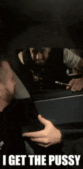 a man in a car with the words " i get the pussy "