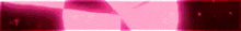 a close up of a pink and red background with a blurred image of a person .
