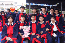 a group of graduates are posing for a photo