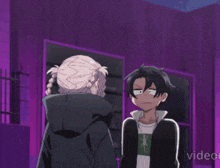 a man and a woman are standing next to each other in a purple room