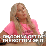 a woman in a pink shirt is sitting at a table and says i 'm gonna get to the bottom of it