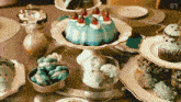 a table topped with a variety of desserts including a cake