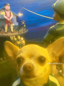 a dog is standing in front of a painting of a man and a doll with the words trashfeed.tv below it