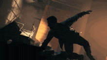 a silhouette of a man in a dark room